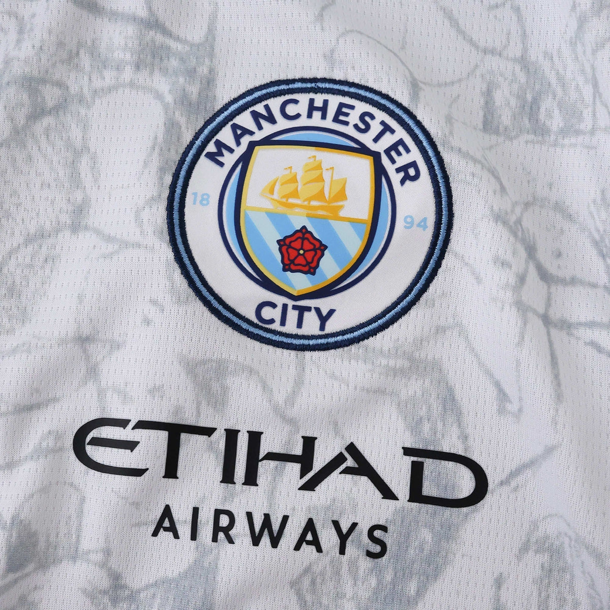 Manchester City 25/26 x KidSuper Jersey - crest and sponsor detail