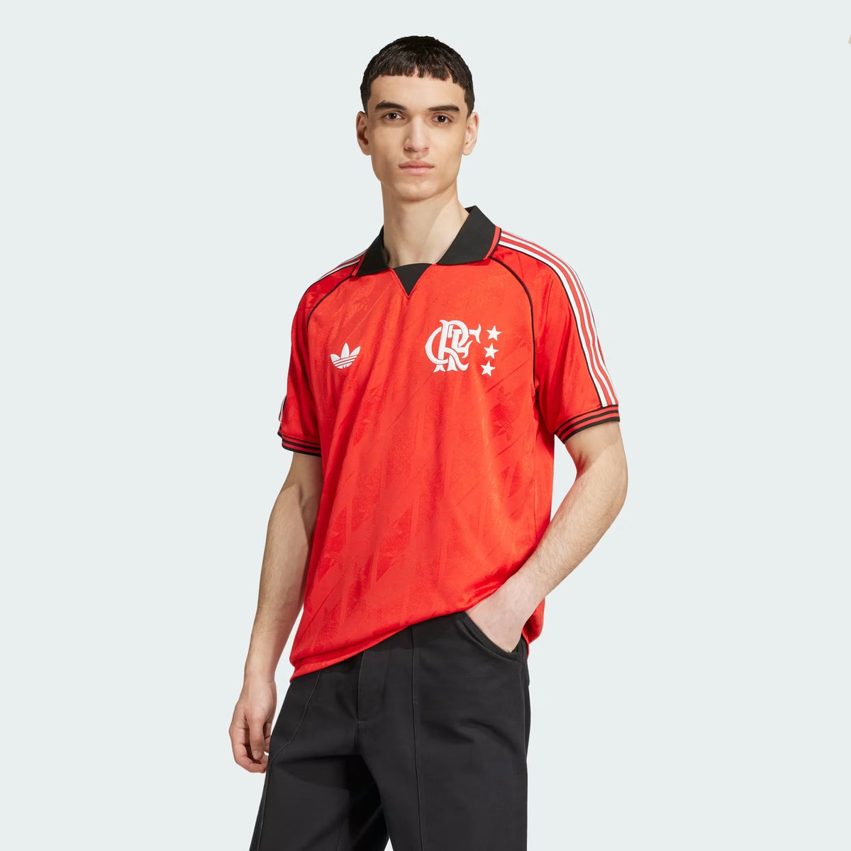 Flamengo 2026 lifestyle jersey in red with black polo collar, worn by model