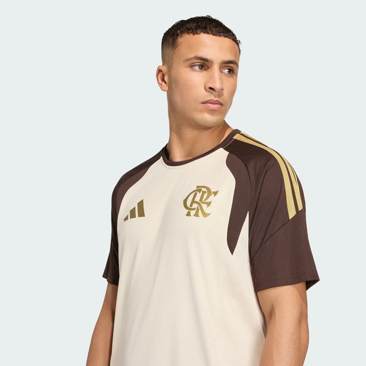 Flamengo 2026 staff jersey in beige with brown raglan sleeves, worn by model