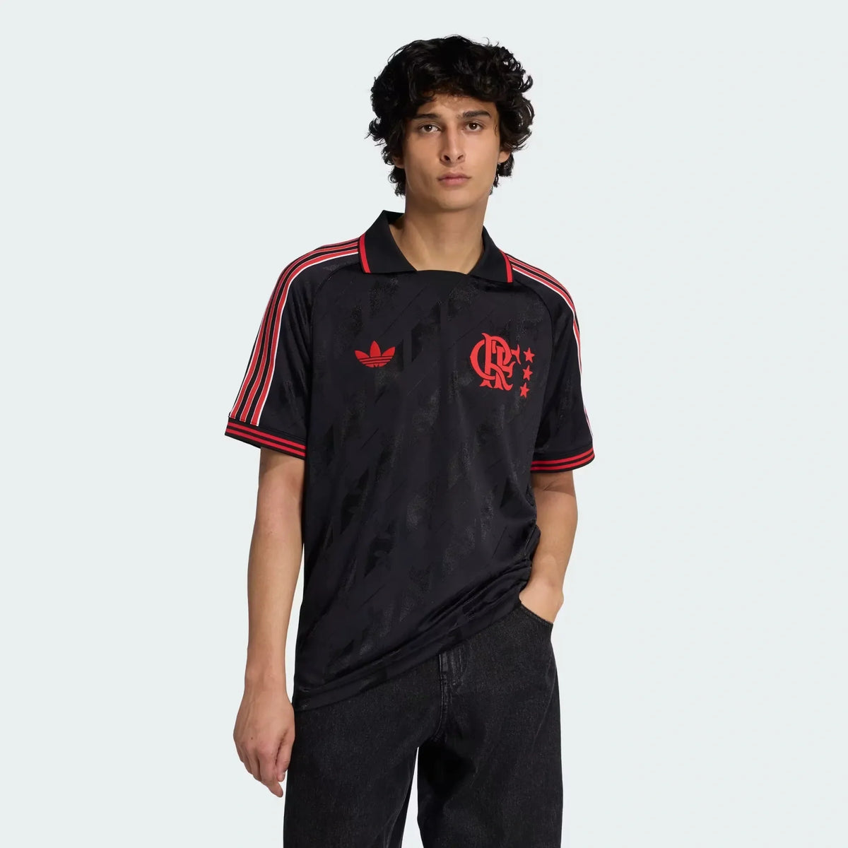 Flamengo 2026 lifestyle jersey in black with red trim and polo collar, worn by model