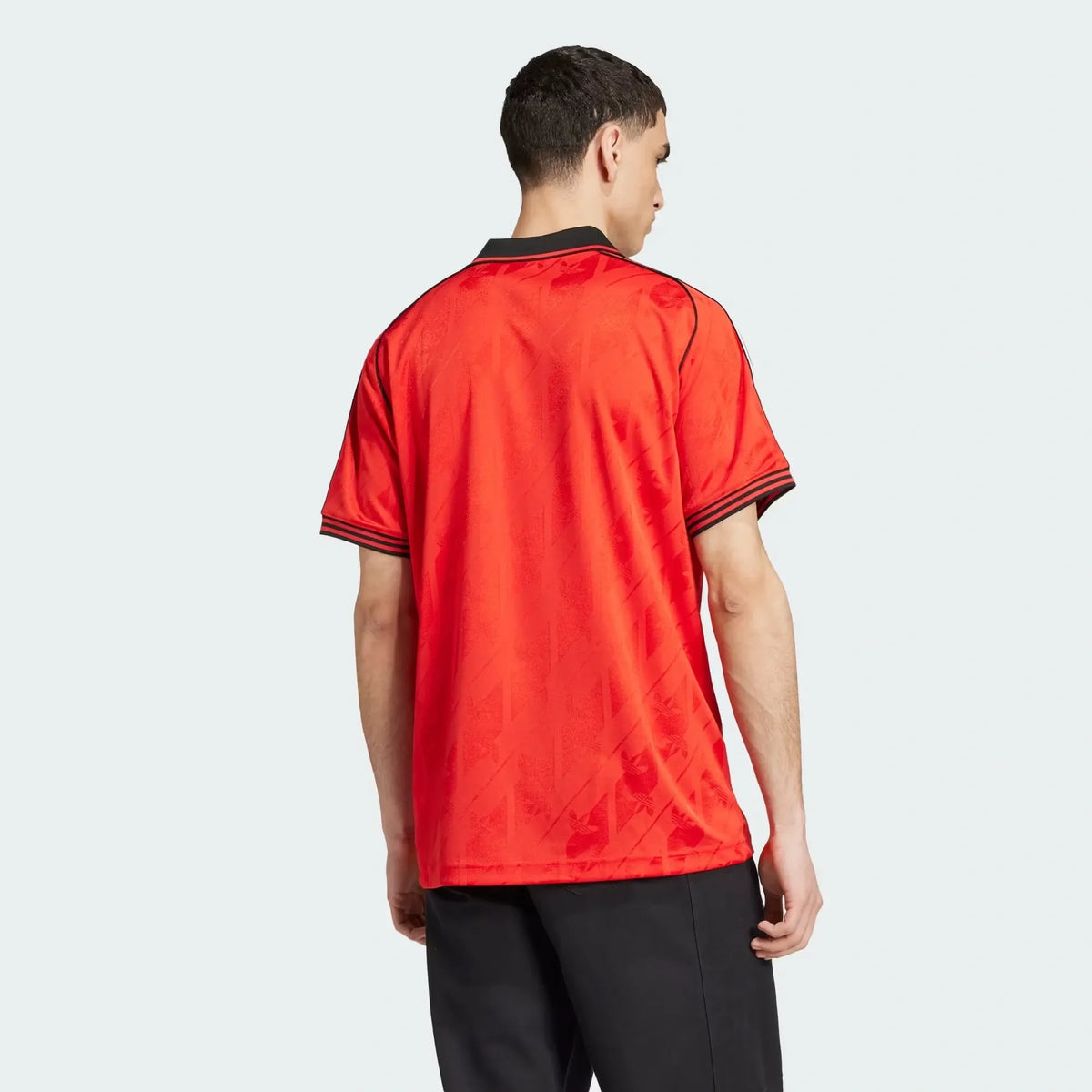 Flamengo 2026 lifestyle jersey in red - crest close-up, worn by model